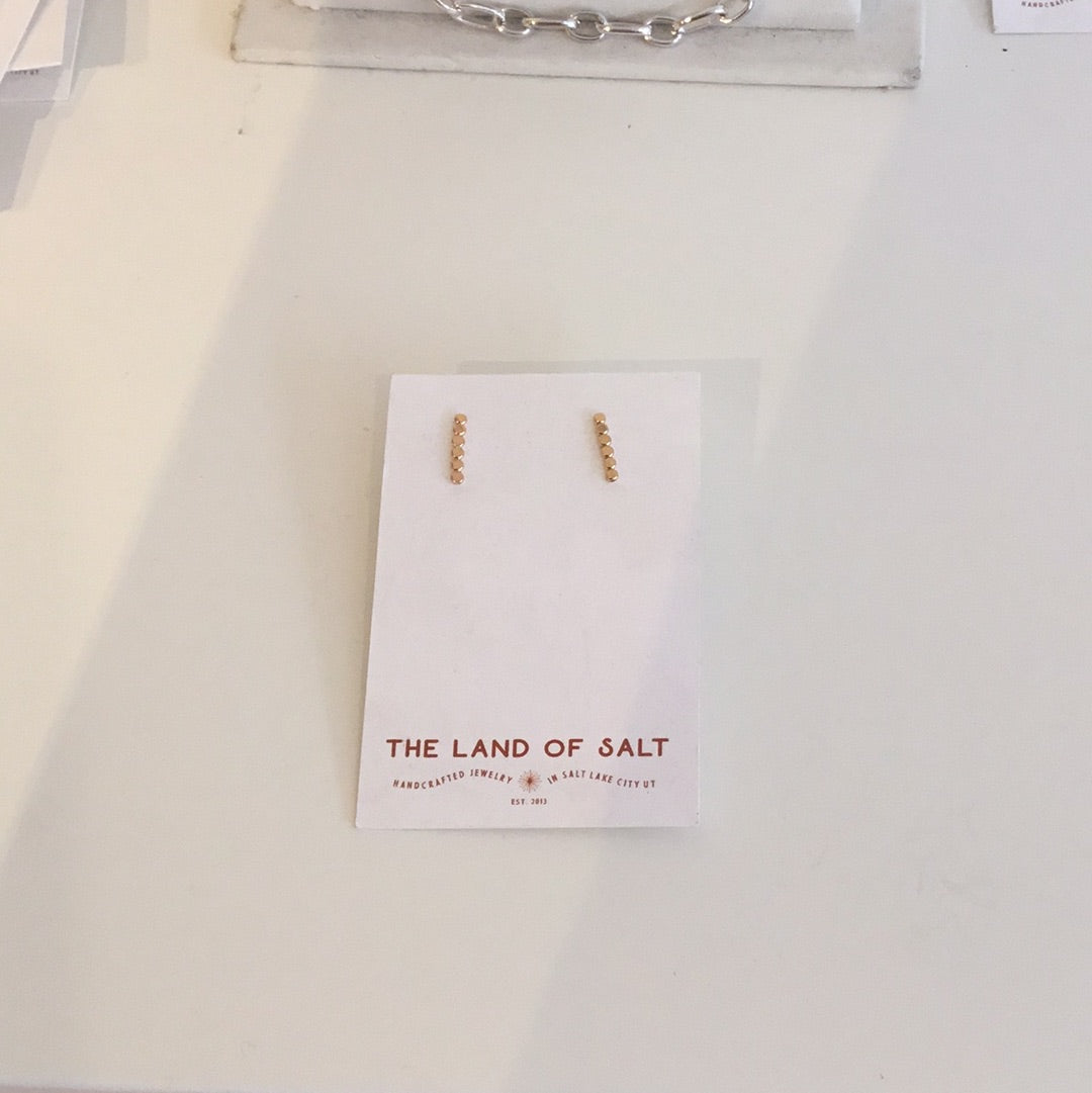 The land of salt gold stud earrings
